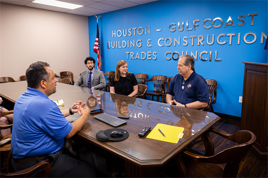 Rep. Fletcher sits in a conference room with members of her staff and the GCHBCTC