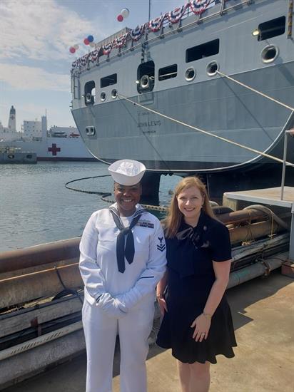 Rep. Fletcher and Petty Officer Caldwell in front of the USNS John Lewis